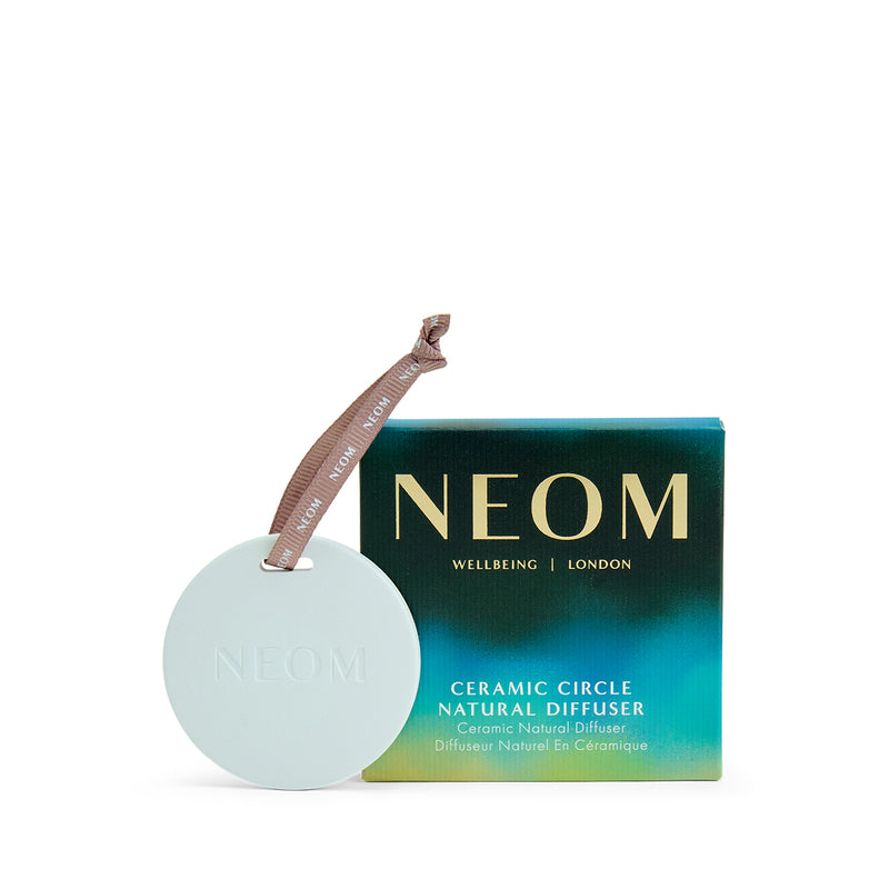 NEOM ceramic circle natural diffuser with packaging on a white background