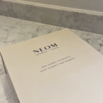 NEOM It’s All Rosy Duo gift set being unboxed from a branded gift box