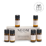 NEOM essential oil blend scent discovery set with six small bottles on a white background with a Perfect Gift roundel with a present