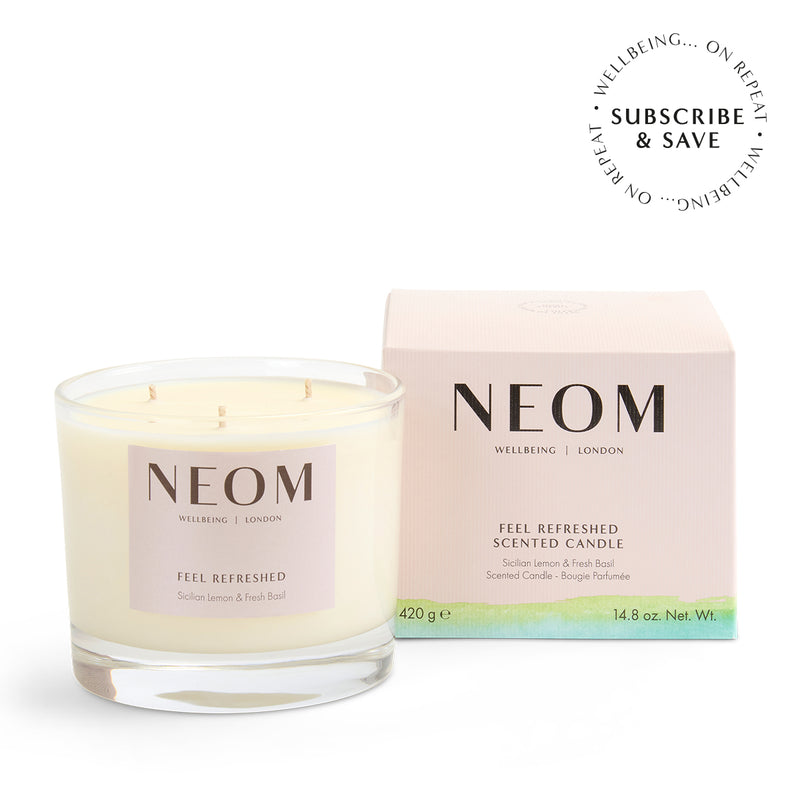 NEOM Feel Refreshed 3 Wick Candle on a white background with subscription roundel