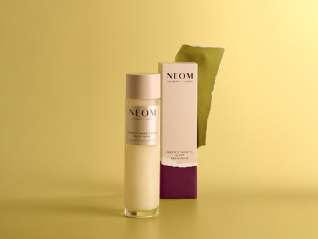 NEOM Perfect Night’s Sleep bath foam and box on yellow background for men’s gifting.