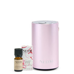 NEOM essential oil bottle and diffuser on a white background