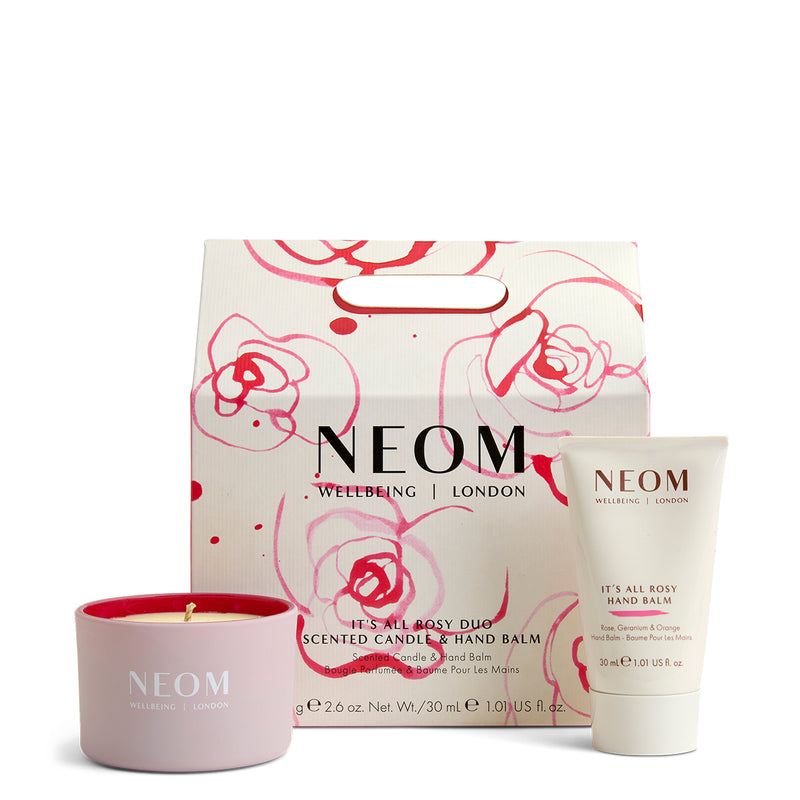 NEOM skincare products including a candle, hand balm, and packaging on a white background