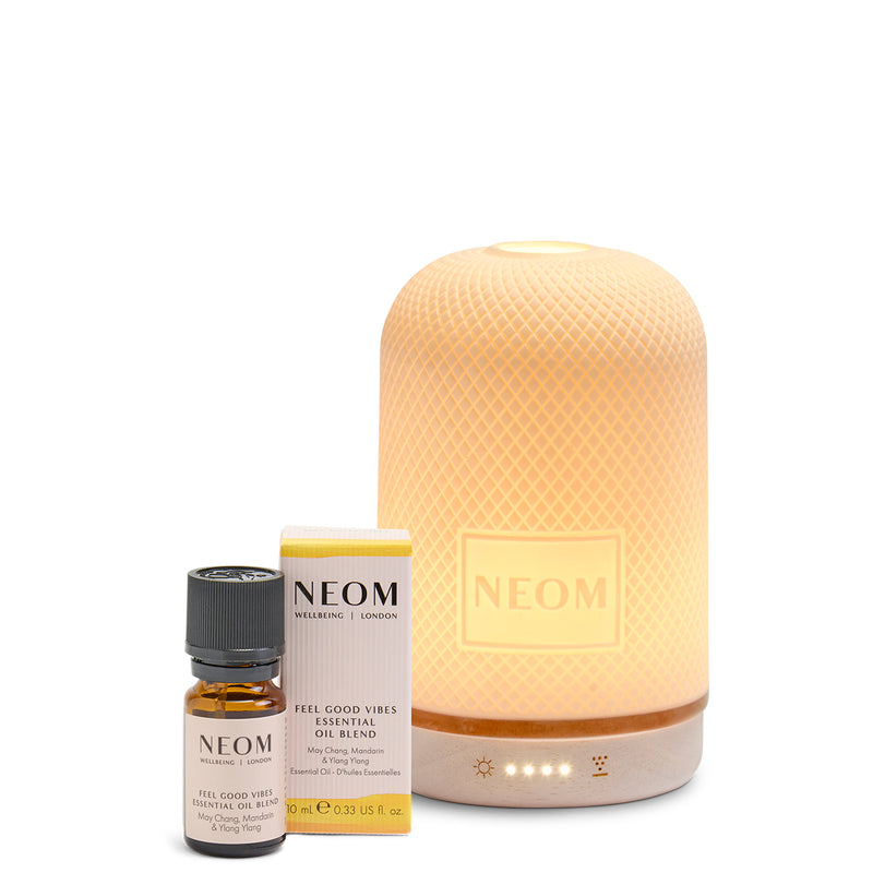 NEOM Wellbeing Feel Good Vibes Essential Oil Blend 10ml with the electric Wellbeing Pod diffuser