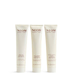 Three NEOM body butters on a white background