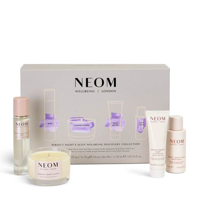 NEOM sleep wellbeing collection with various products on a white 