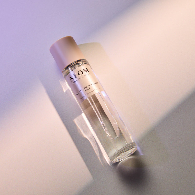 NEOM sleep mist bottle on a gradient background
