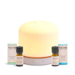 NEOM pod luxe diffuser and 2 FREE essential oils on a white background