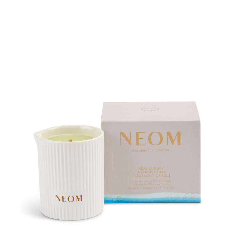 NEOM candle and packaging on a white background