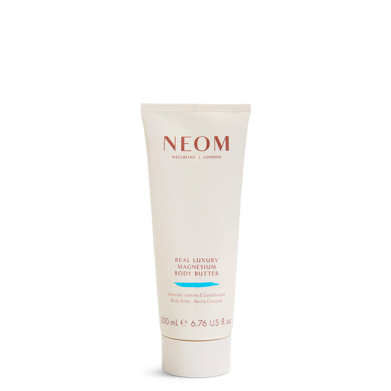 Neom body butter tube on a white background