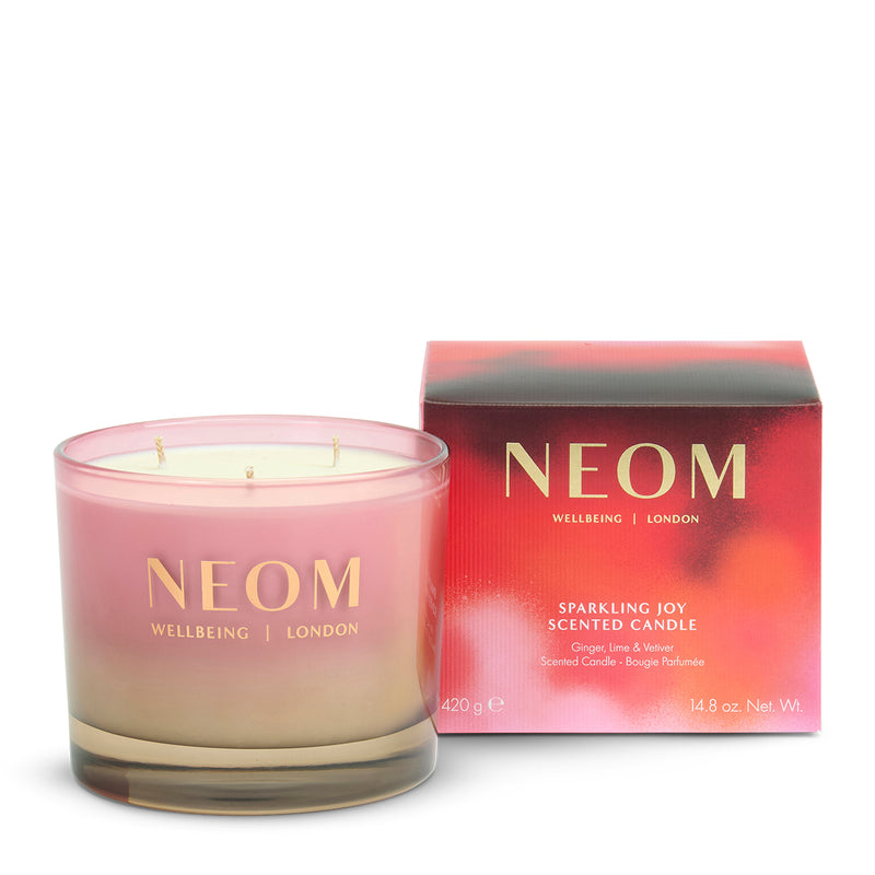 NEOM candle and packaging on a white background