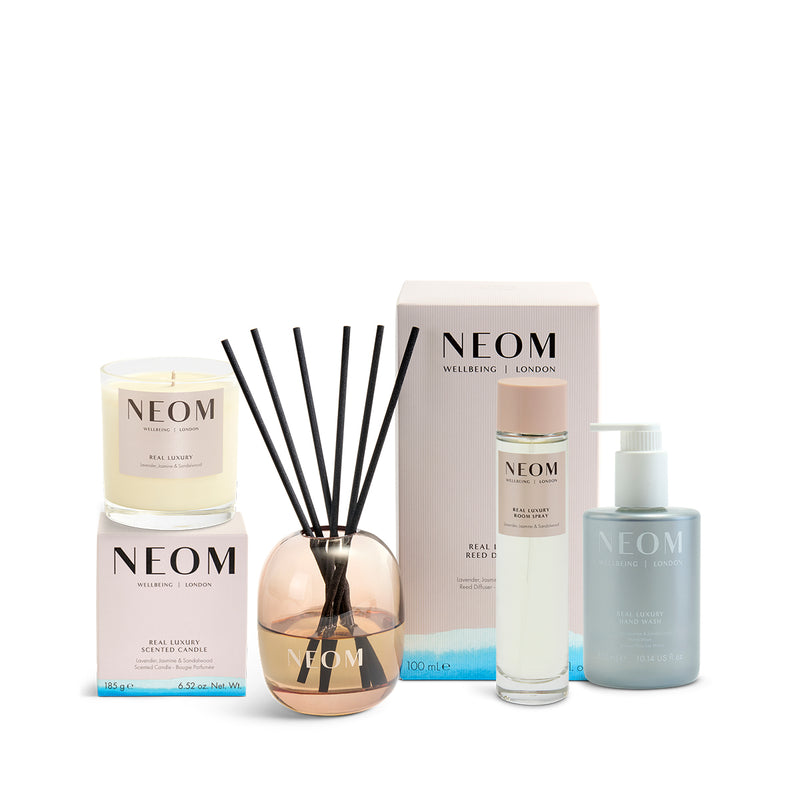 NEOM new home haven gift set including a reed diffuser, candle, and skimcare on a white background