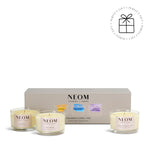 NEOM Wellbeing Candle Trio with packaging on a white background