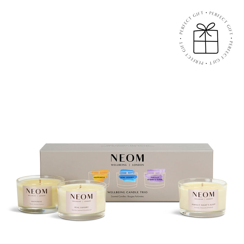 NEOM Wellbeing Candle Trio with packaging on a white background