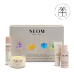 NEOM wellbeing discovery collection with various products on a white background
