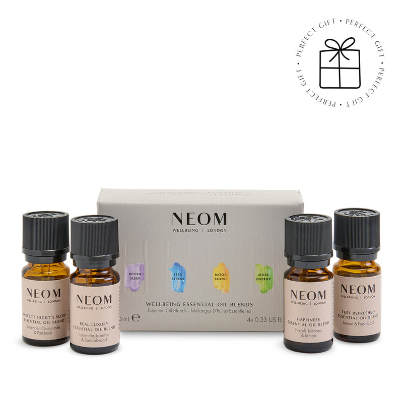 NEOM essential oil blends with a branded box on a white background with a Perfect Gift roundel with a present