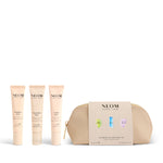 NEOM pens including a gold pouch on a white background